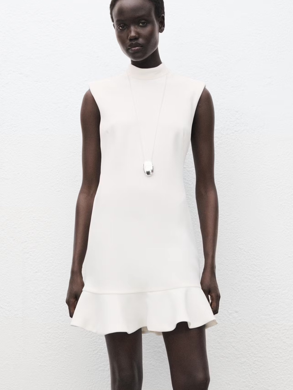 High Neck Sleeveless White Ruffle-Hem Dress
